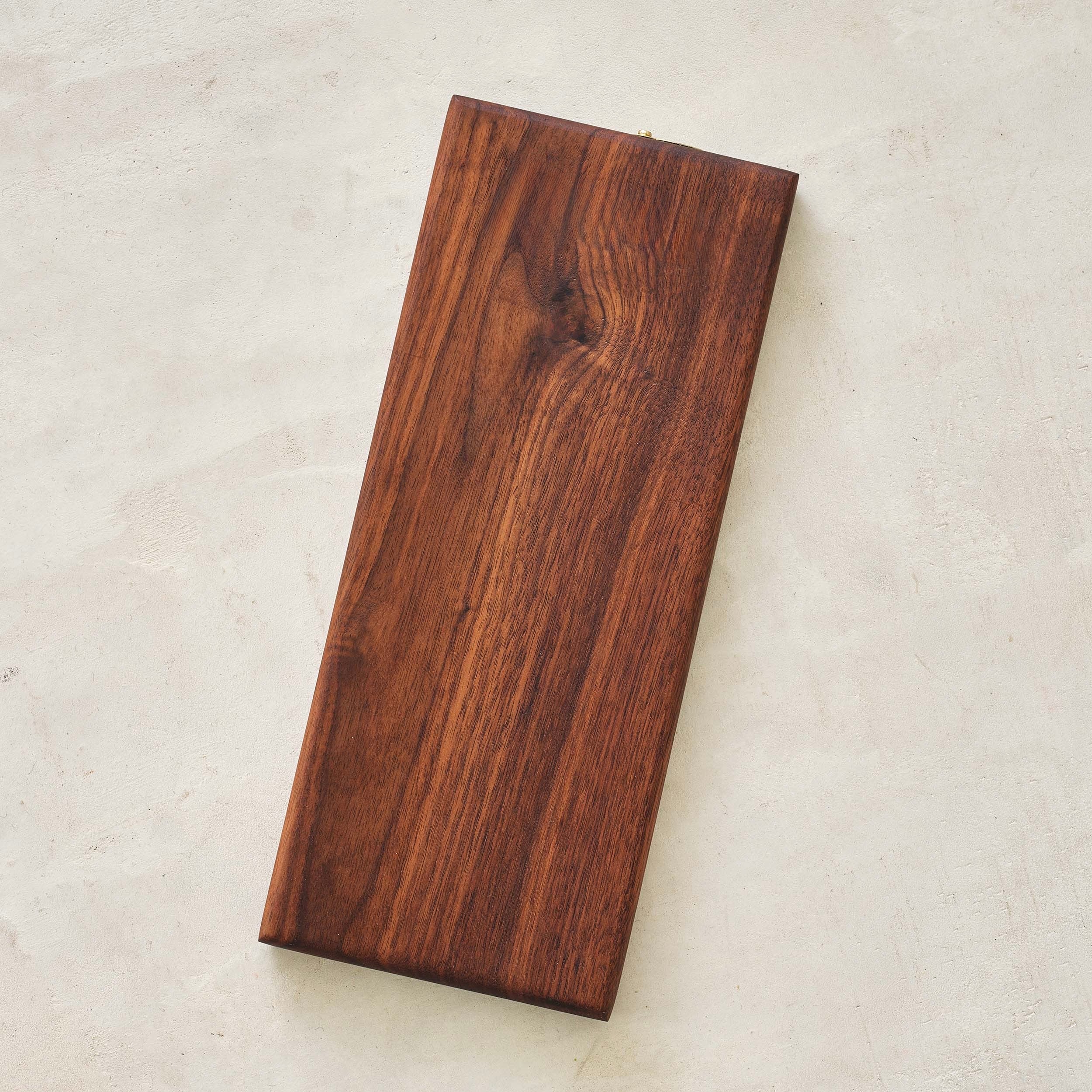 rectangular block of walnut wood with distinctive grain patterns